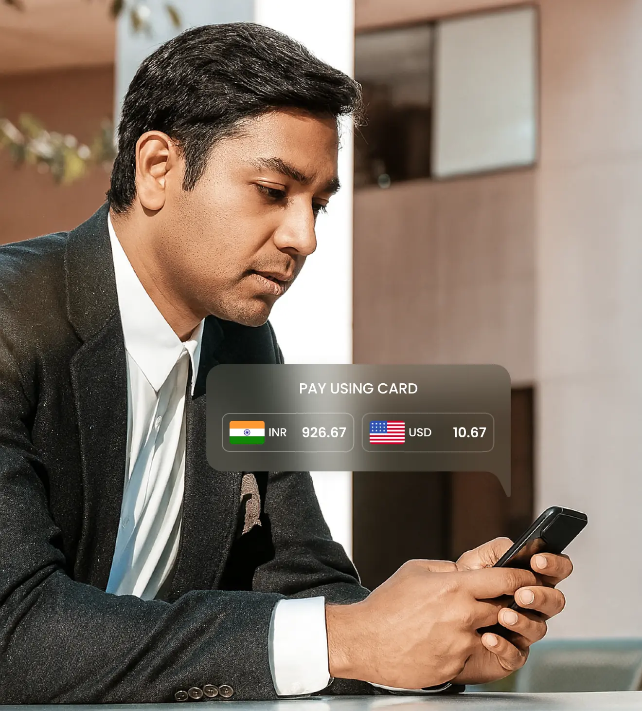 Man making a payment on mobile using DCC feature with global currency options displayed
