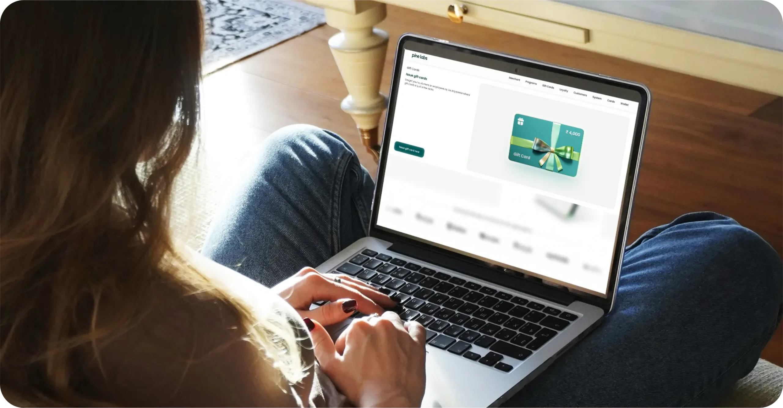 Woman issuing digital gift cards seamlessly on a laptop through Pine Labs platform