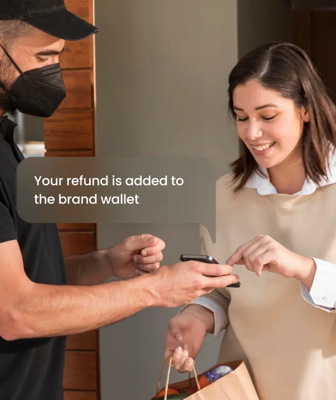 Delivery person processing an instant card-based refund to a customer's brand wallet using a mobile device