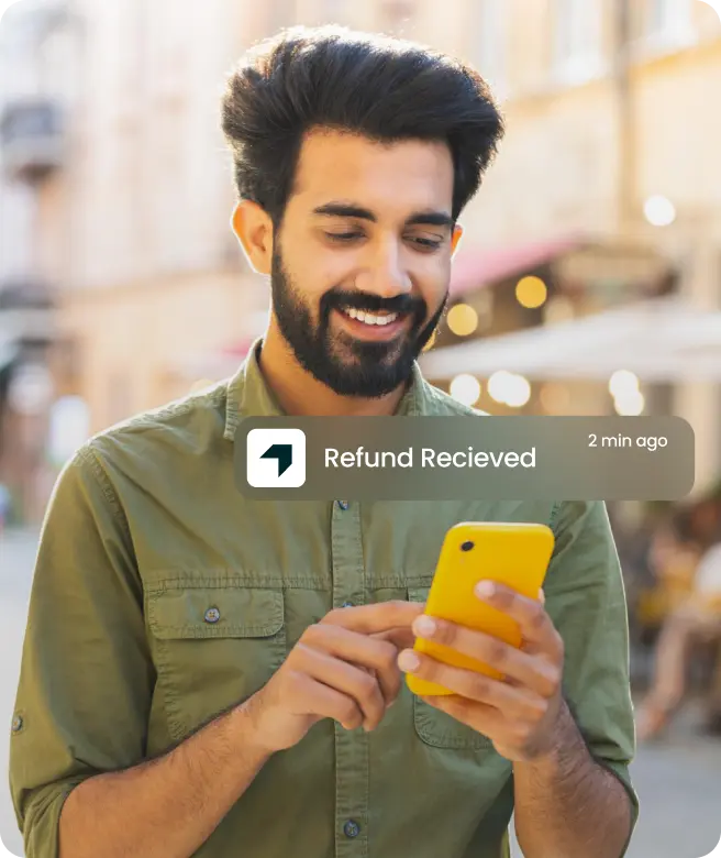 Man receiving refund notification on smartphone