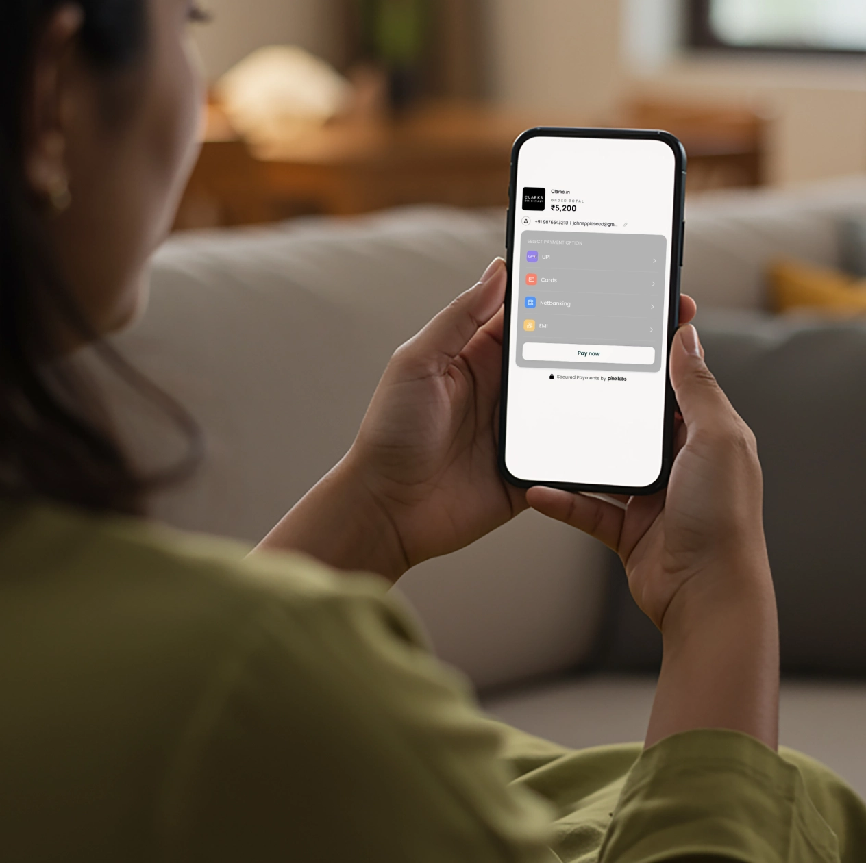 Woman using a smartphone to make utility bill payments through a digital platform