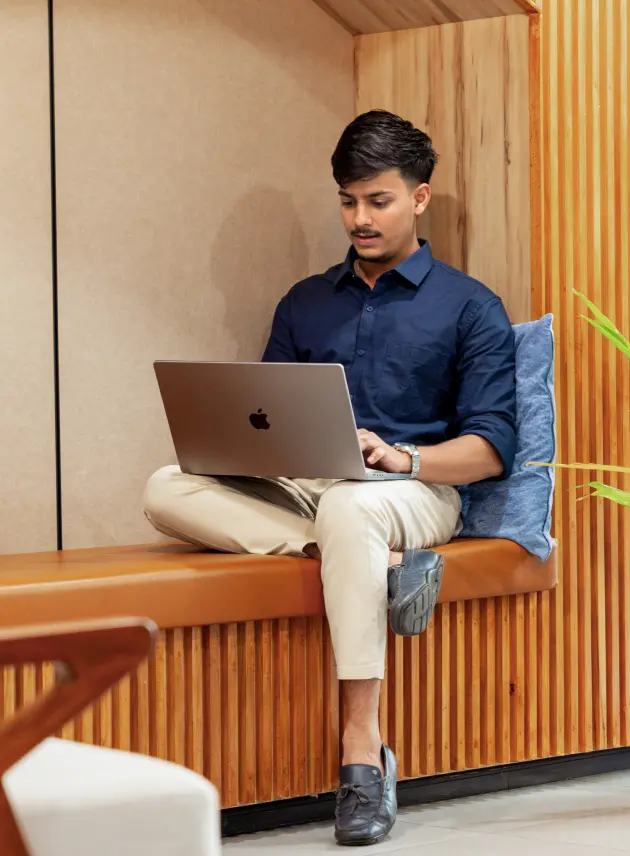 Man working on a laptop in a quiet workspace representing deep focus and productivity