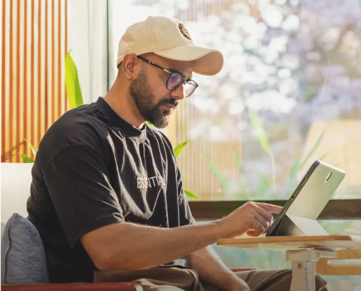 Innovate with Every Step Forward Man working on laptop in a modern space representing innovation and future-focused thinking